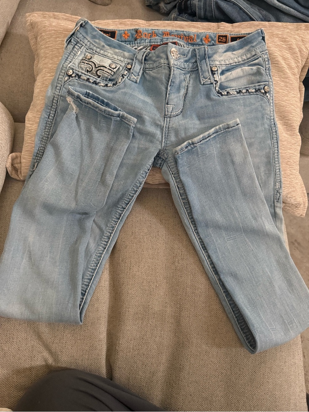 Light Blue Women’s Rock Revival Jeans with Embroidered Pocket and bling  Detail
